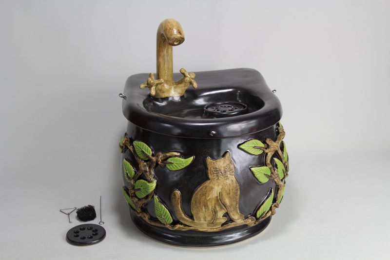 Small cordless pet fountain with faucet spout and internal USB battery