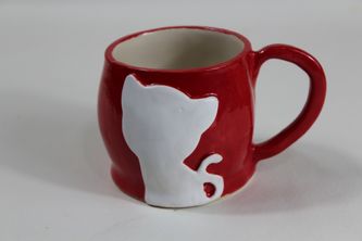 Red handmade stoneware coffee mug with white cat decor