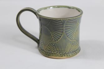 Handcrafted green structured coffee mug