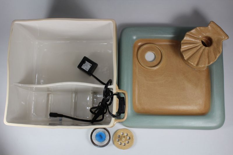 Square pet fountain with shell spout and internal battery