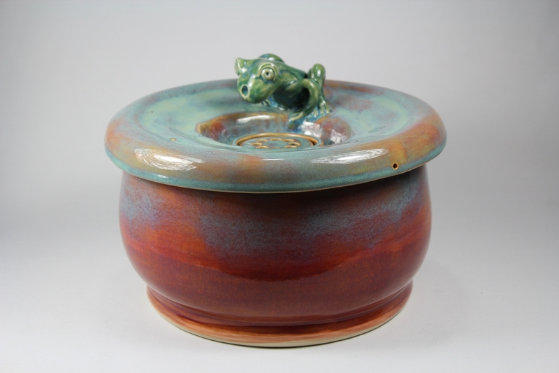 pet drinking fountain with a large secured coon lid and frog spout