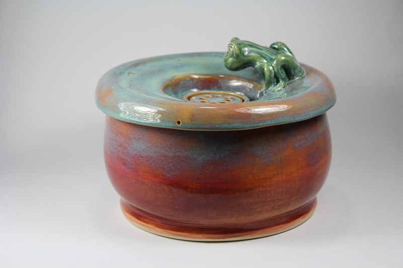 pet drinking fountain with a large secured coon lid and frog spout