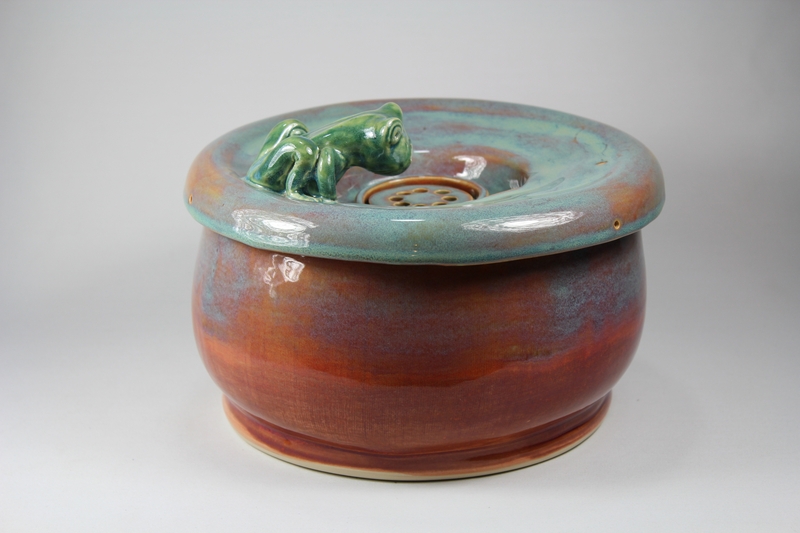 pet drinking fountain with a large secured coon lid and frog spout