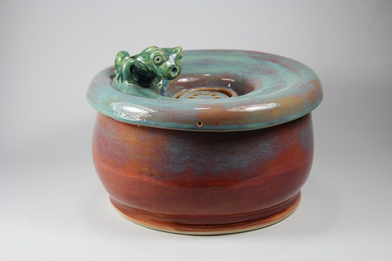 pet drinking fountain with a large secured coon lid and frog spout
