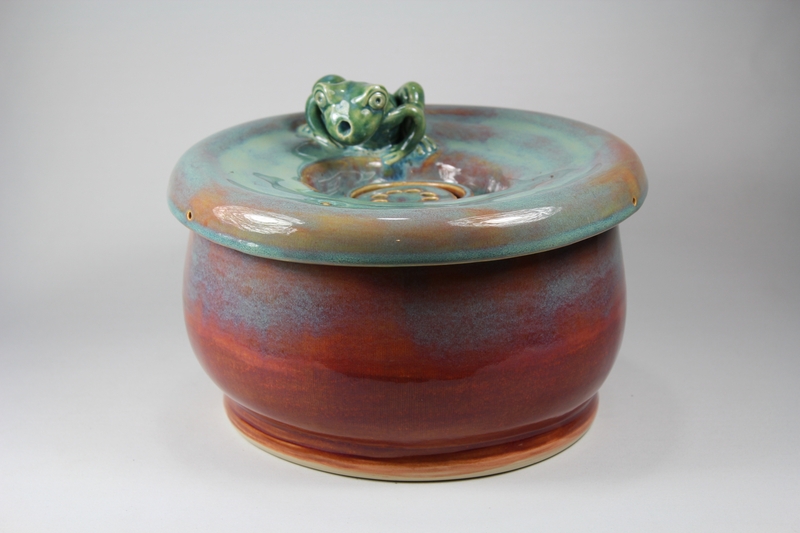 pet drinking fountain with a large secured coon lid and frog spout