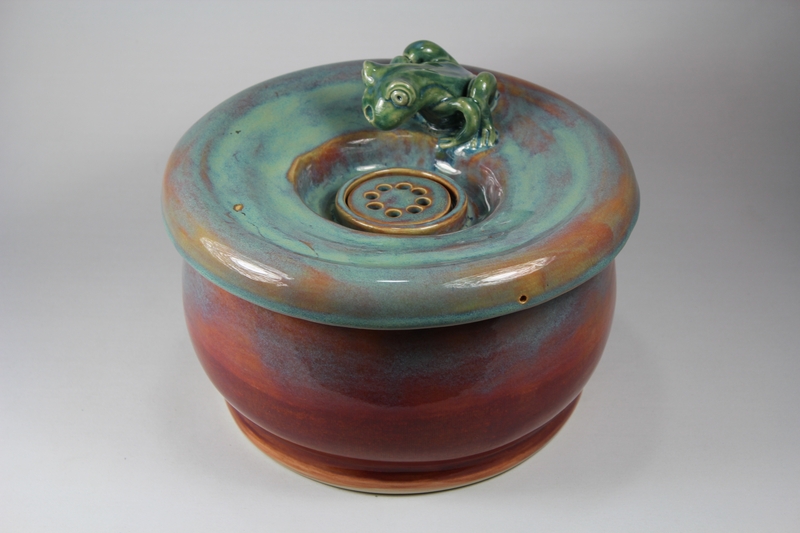 pet drinking fountain with a large secured coon lid and frog spout