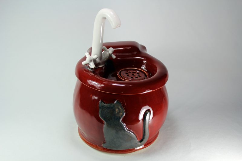 Small cordless pet fountain with faucet spout and internal battery