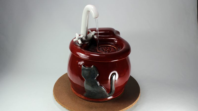 Small cordless pet fountain with faucet spout and internal battery