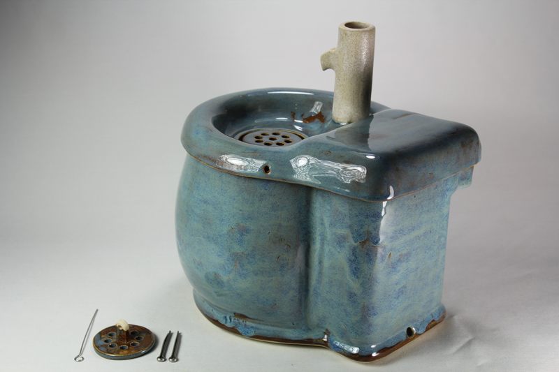 Small cordless pet fountain with trunk spout and internal battery