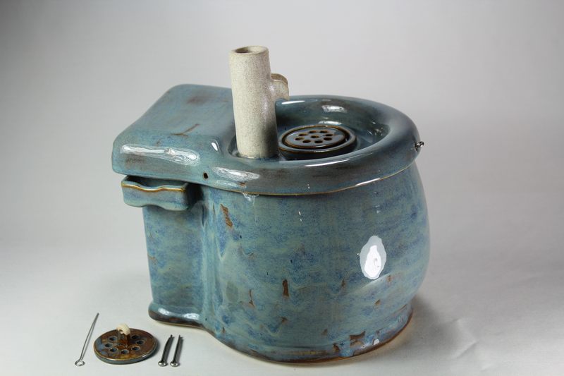 Small cordless pet fountain with trunk spout and internal battery