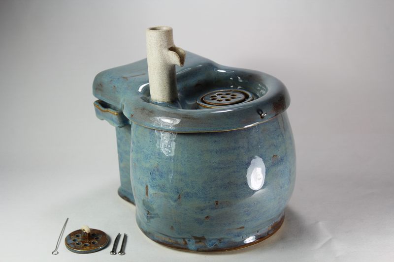 Small cordless pet fountain with trunk spout and internal battery