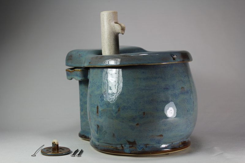 Small cordless pet fountain with trunk spout and internal battery