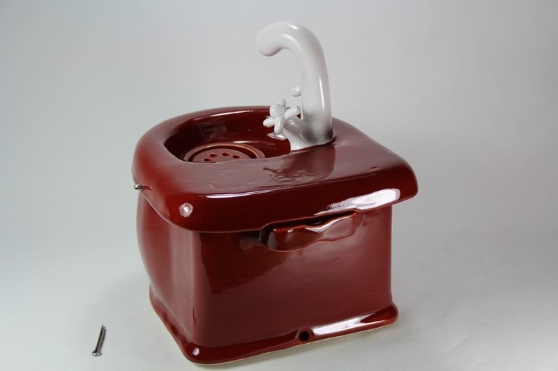 Small cordless pet fountain with faucet spout and internal battery