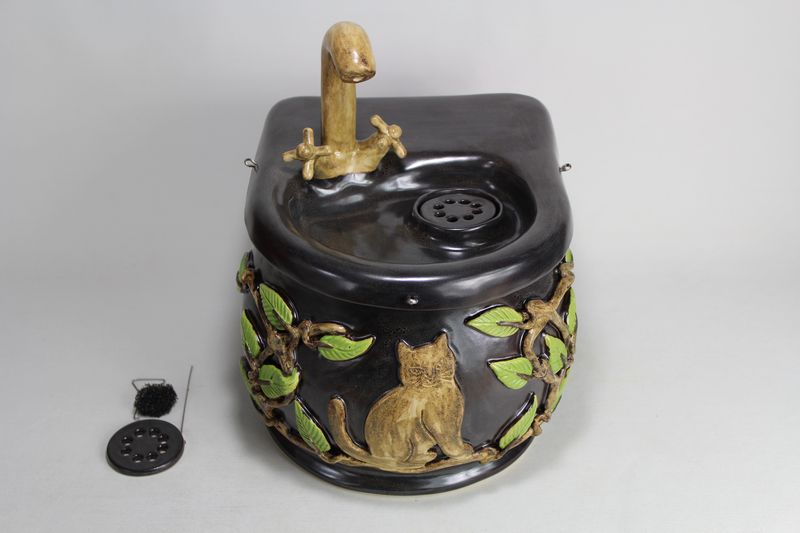 Small cordless pet fountain with faucet spout and internal USB battery